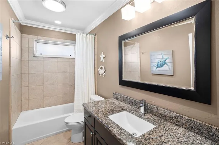 The guest bathroom is conveniently situated between the two guest bedrooms; and the bath recently experienced a total renovation.