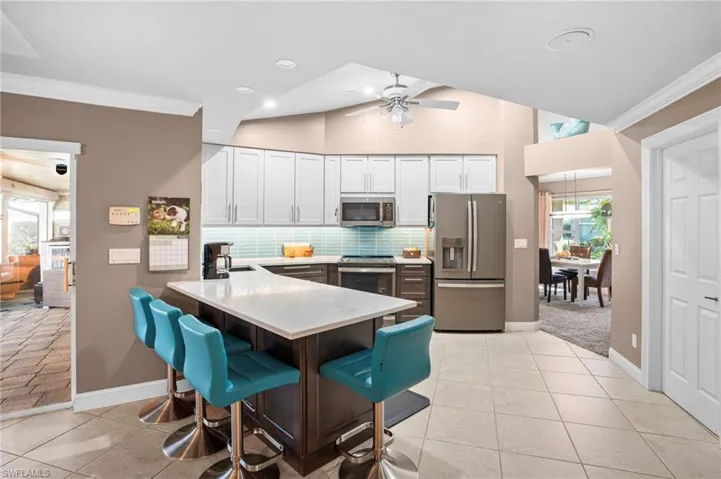 The designed breakfast peninsula is convenient to the family room and lanai.