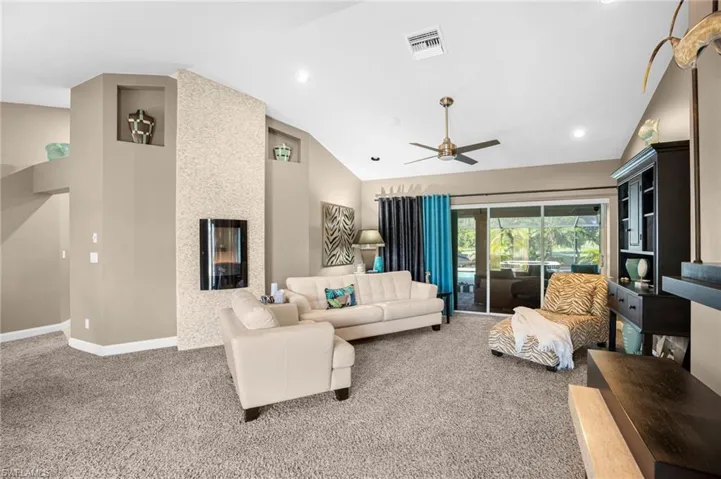 Greeting your visitors is a bright and comfortable sitting area leading to the lanai.