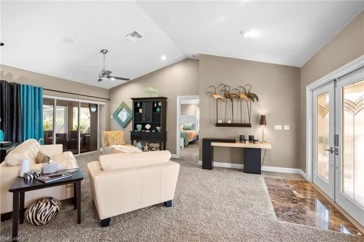 Living room separates the primary bedroom suite from the rest of home.