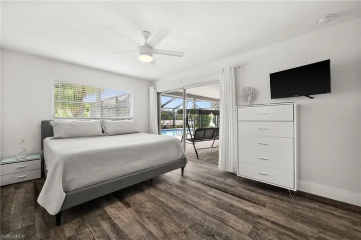 Master Bedroom with sliding door directly to the lanai / pool area