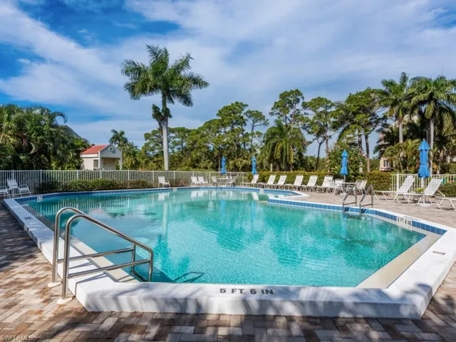 Community pool with a patio area