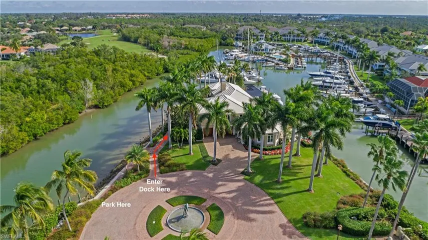 Aerial view of a nearby body of water and a tree filled landscape