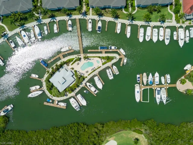 Aerial view of property's location with a large body of water