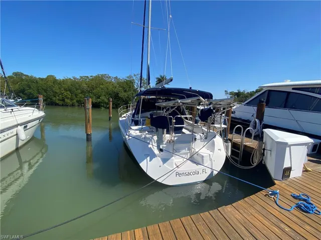 Dock area featuring a water view
