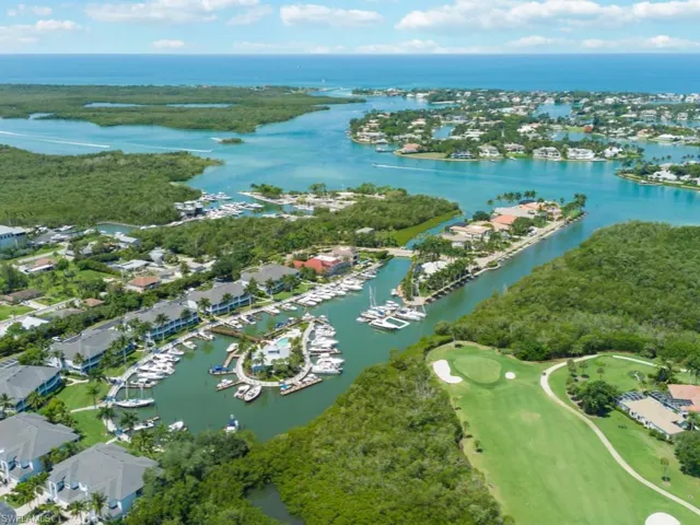 Aerial overview of property's location featuring a large body of water