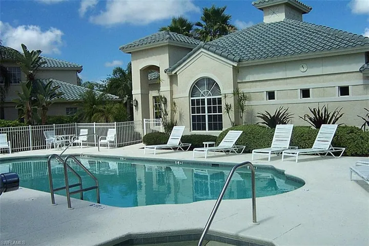 Community pool with a patio