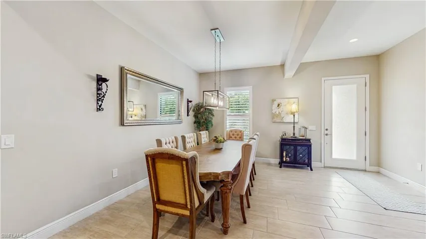 FORMAL DINING AREA, PLANTATION SHUTTERS, LARGE TILE, GLASS  8' ENTRY DOOR