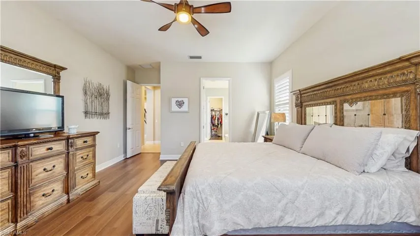 MASTER BEDROOM, LAMINATE FLOORING, PLANTATION SHUTTERS, OVERSIZE MASTER, BEAUTIFUL COLOR TONE ON WALLS, ENTRANCE TO MASTER BATH