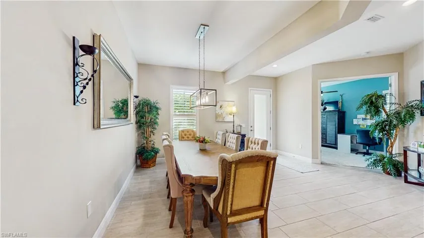 FORMAL DINING ROOM WITH LIIGHTS, DINING TABLE WITH 8 CHAIRS, PLANTATION SHUTTERS, VIEW INTO 6TH BEDROOM OR OFFICE, 8' GLASS ENTRANCE DOOR