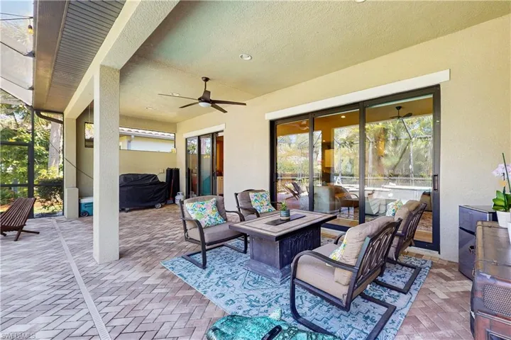 COVERED LANAI, WITH PAVERS, ROGUH IN FOR OUTDOOR KITCHENETTE, 2 SETS OF SLIDING DOORS