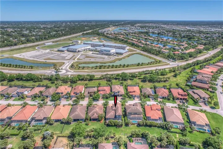 DRONE VIEW OF HOME & OTHER HOMES IN SURROUNDING AREADrone / aerial view with a residential view and a water view