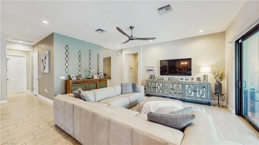 HUGE FAMILY ROOM, ALL TILE FLOORING, MOUNTED TV, HUGE SECTIONAL, DOUBLE SLIDING DOOR TO POOL