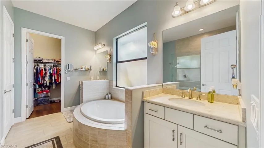 MASTER BATH, WALK-IN CLOSET, TUB, HIS & HER VANITY, TOILET ROOM SEPARATE, LARGE WINDOW FOR NATURLA LIGHT.