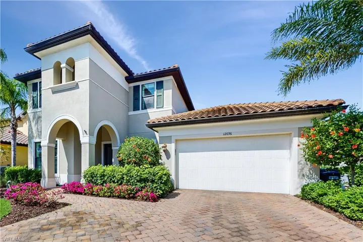 MEDITERRANEAN/SPANISH-STYLE HOME, 2 CAR GARAGE, EXTRA DRIVEWAY W DECORATIVE PAVER, STUCCO & TILE ROOF.