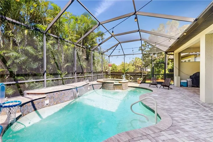 BEAUTIFUL POOL WITH SPA, WATERFALL, PAVER FLOORING, ENCLOSED OVERSIZE LANAI