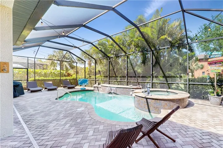 ENCLOSED POOL/SPA & WATERFALL WITH PAVER FLOORING