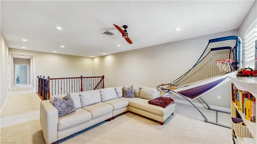 HUGE LOFT, SOFA, GAMES, PLUSH CARPETING, FAN, NATURAL LIGHTING FROM MULTIPLE WINDOWS, BEAUTIFUL RAILING, HALL TO BACK BEDROOMS