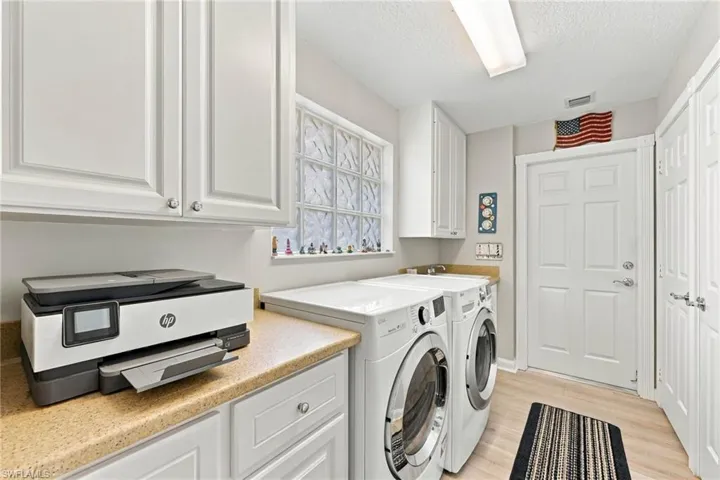 Laundry room with plenty of closet space