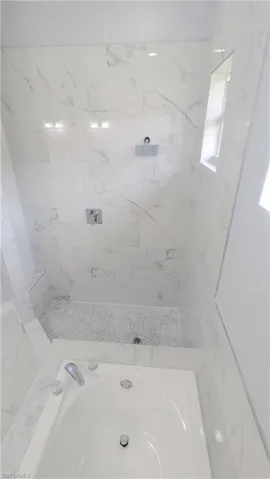Bathroom featuring a tub