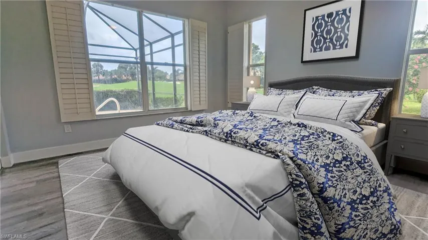 Bedroom featuring multiple windows and wood-type flooring