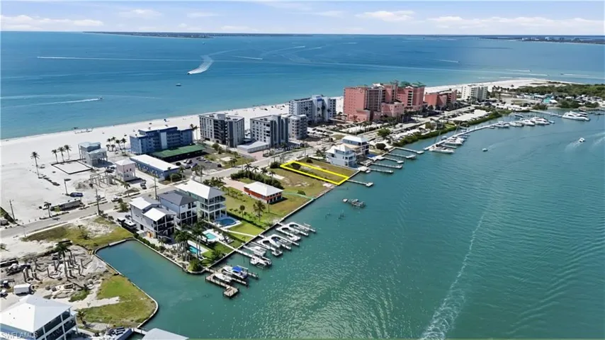 Drone / aerial view of a nearby body of water and numerous boat docks - Virtually Edited Image