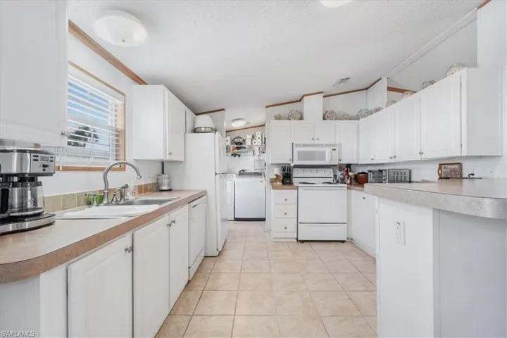 Generous kitchen featuring abundant cabinetry and exceptional storag