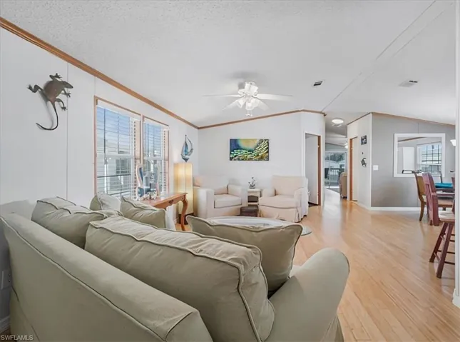 Sunlit living room filled with natural light and beautiful wood floors