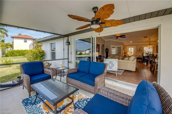 View of patio / terrace with outdoor furniture and a ceiling fan