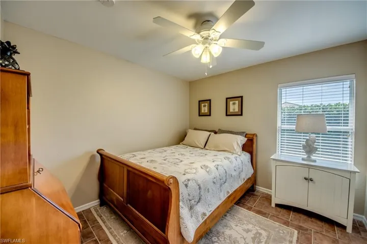 Bedroom featuring baseboards and ceiling fan