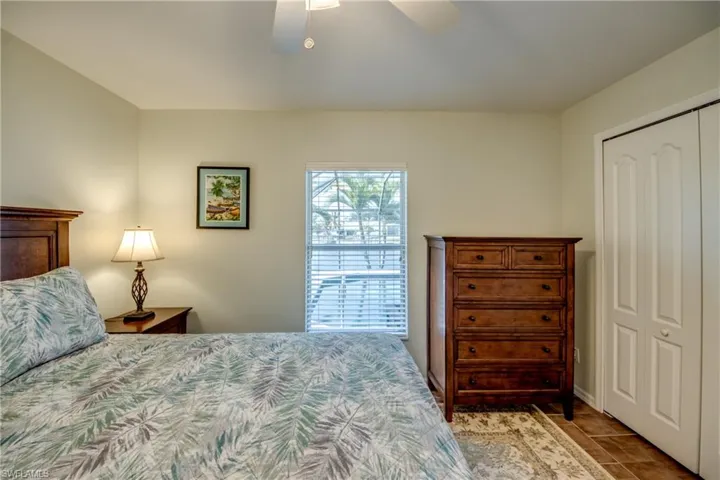 Bedroom featuring a ceiling fan and a closet