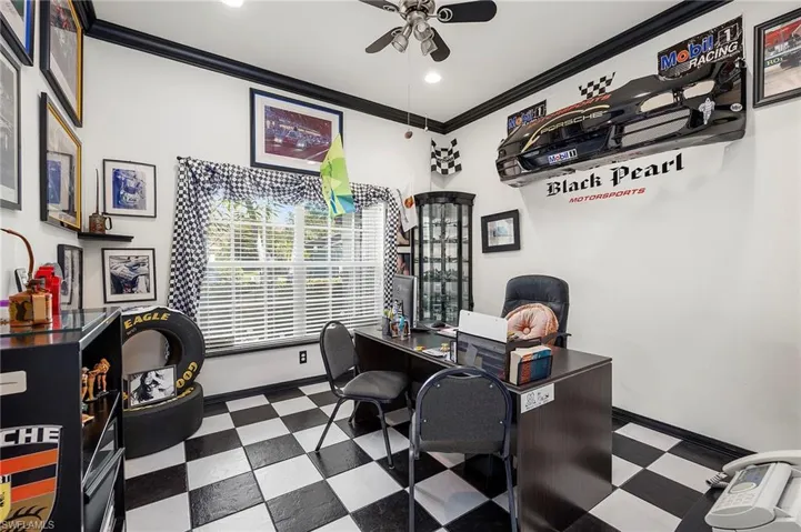 Office area featuring dark floors, crown molding, and recessed lighting