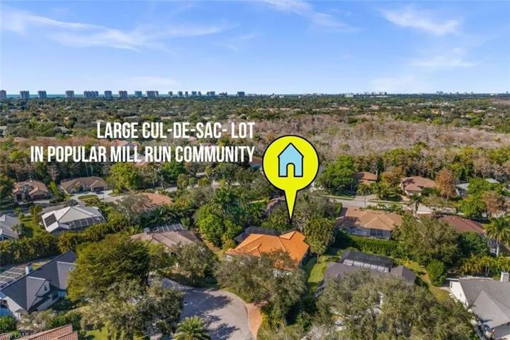 Aerial view of property's location with nearby suburban area and skyline