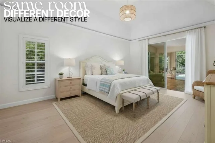 Bedroom with light wood-style flooring, multiple windows, and access to outside