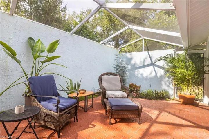 View of patio / terrace featuring a sunroom and a lanai
