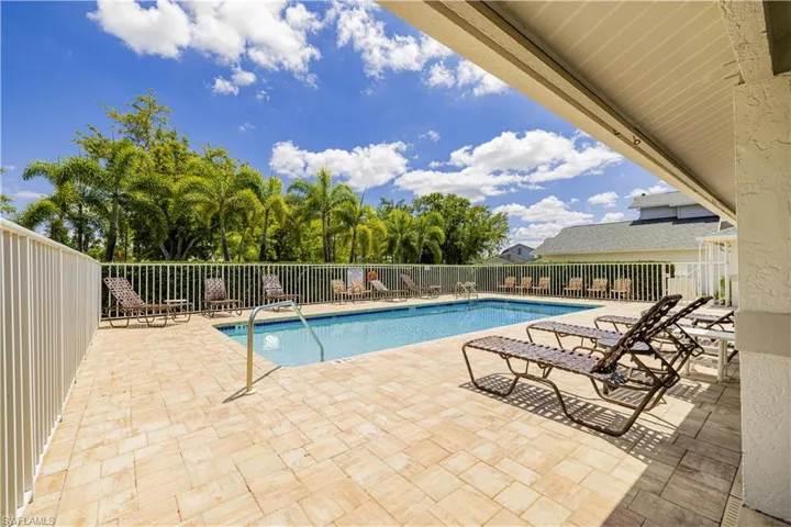 Community pool featuring a patio area