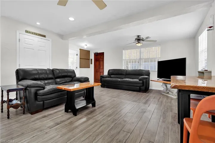 Living room featuring recessed lighting,  ceiling,  floors, and ceiling fan