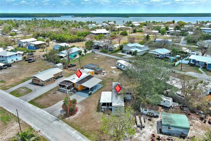 Aerial view with a residential view and a water view. showing adjoining property that's for sale
