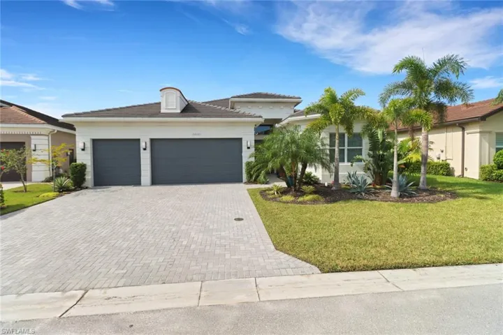 View of front facade with a front yard and a garage