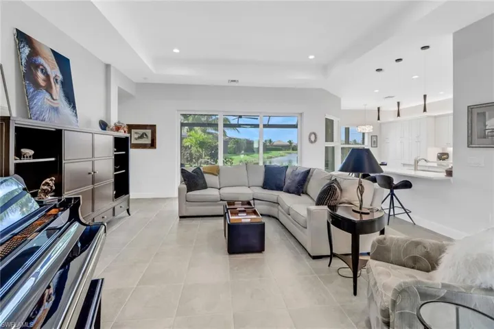 Tiled living room with a tray ceiling