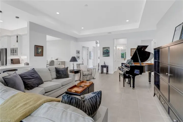 Tiled living room with a raised ceiling