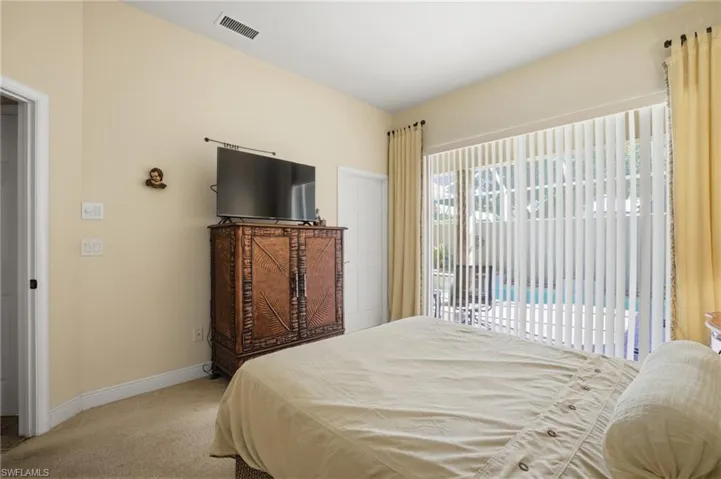 Guest bedroom and walk in closet looking onto courtyard