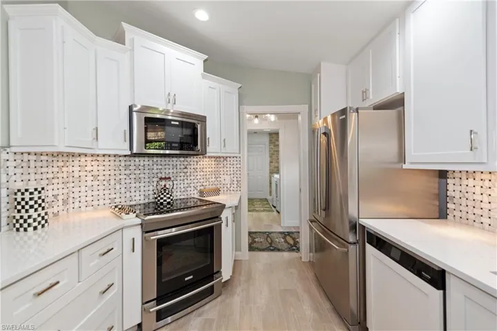 Sparkling Spacious kitchen wit newer open concept to living, breakfast bar and living area
