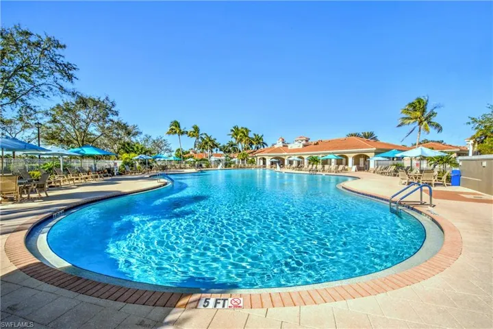 Resort pool with indoor and outdoor restaurant service