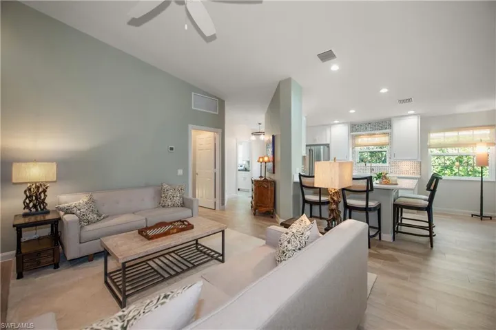 Living rm to foyer, kitchen, and living rm