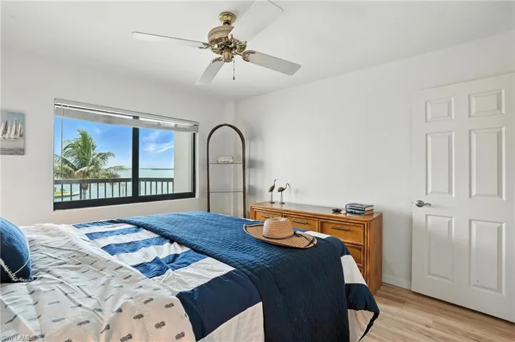 Bedroom with light wood-type flooring and a ceiling fan