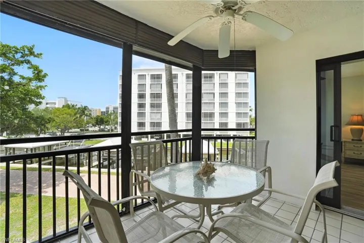 Balcony with a ceiling fan and a city view