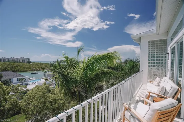 Balcony with a water view and outdoor lounge area