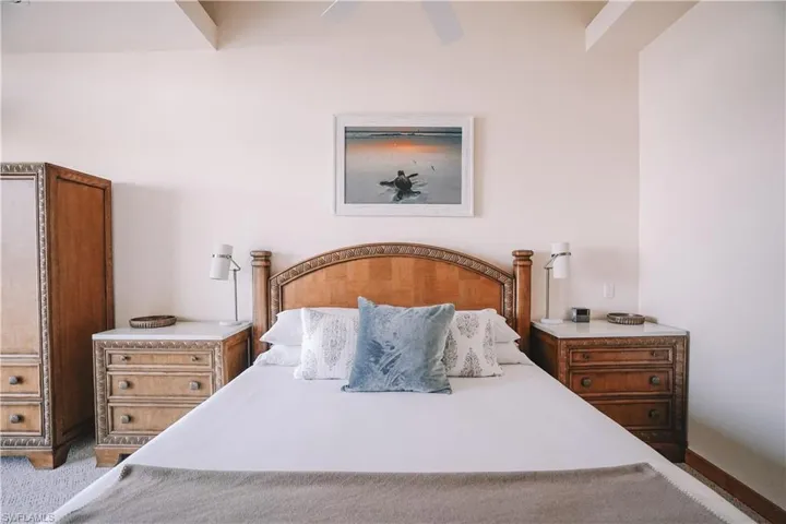 Carpeted bedroom featuring ceiling fan