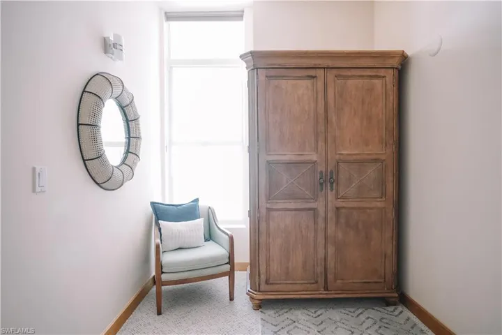 Living area featuring light carpet